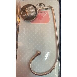 Purse holder hook silver with rhinestone purse accent.